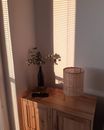 White Flower in Vase on Brown Wooden Table