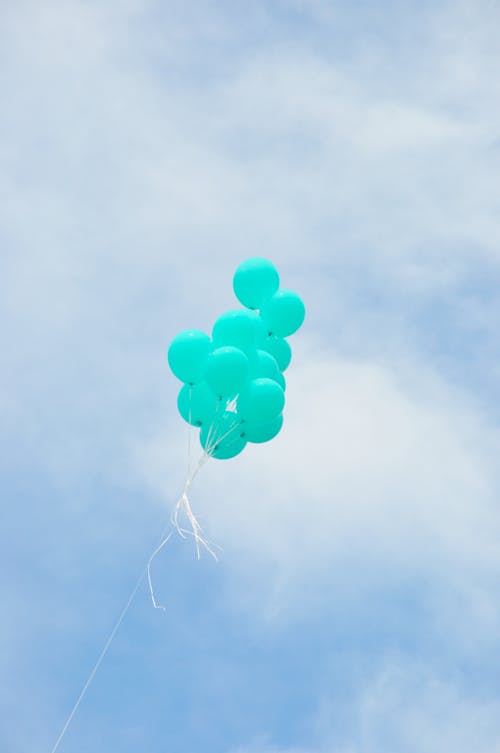 Green Balloons Under the Blue Sky