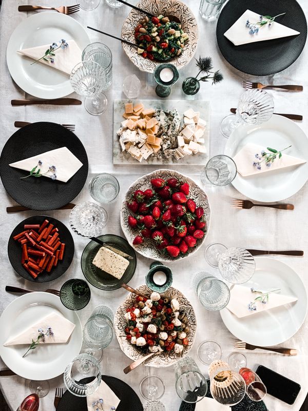 Overhead view of a dining table with assorted gourmet dishes