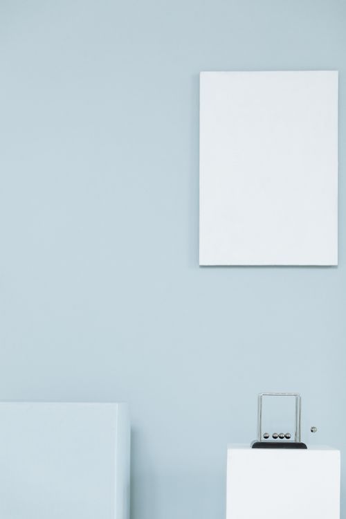 Free Minimalist interior scene with blank white frames for creative design concepts. Stock Photo