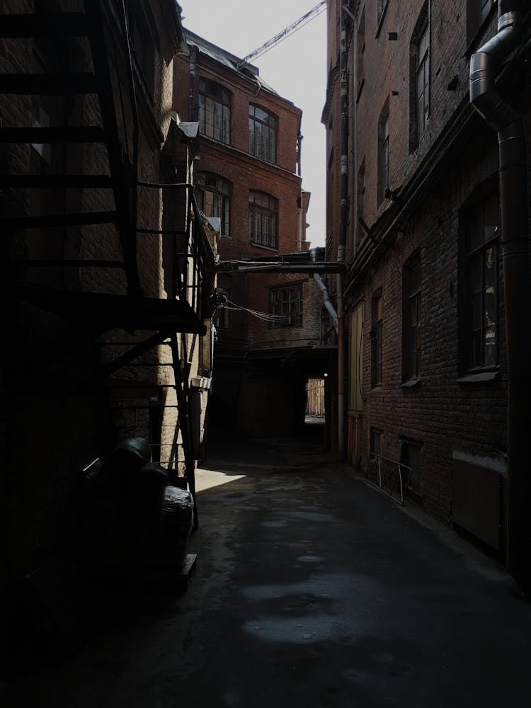 An Alleyway Between Brick Apartment Building