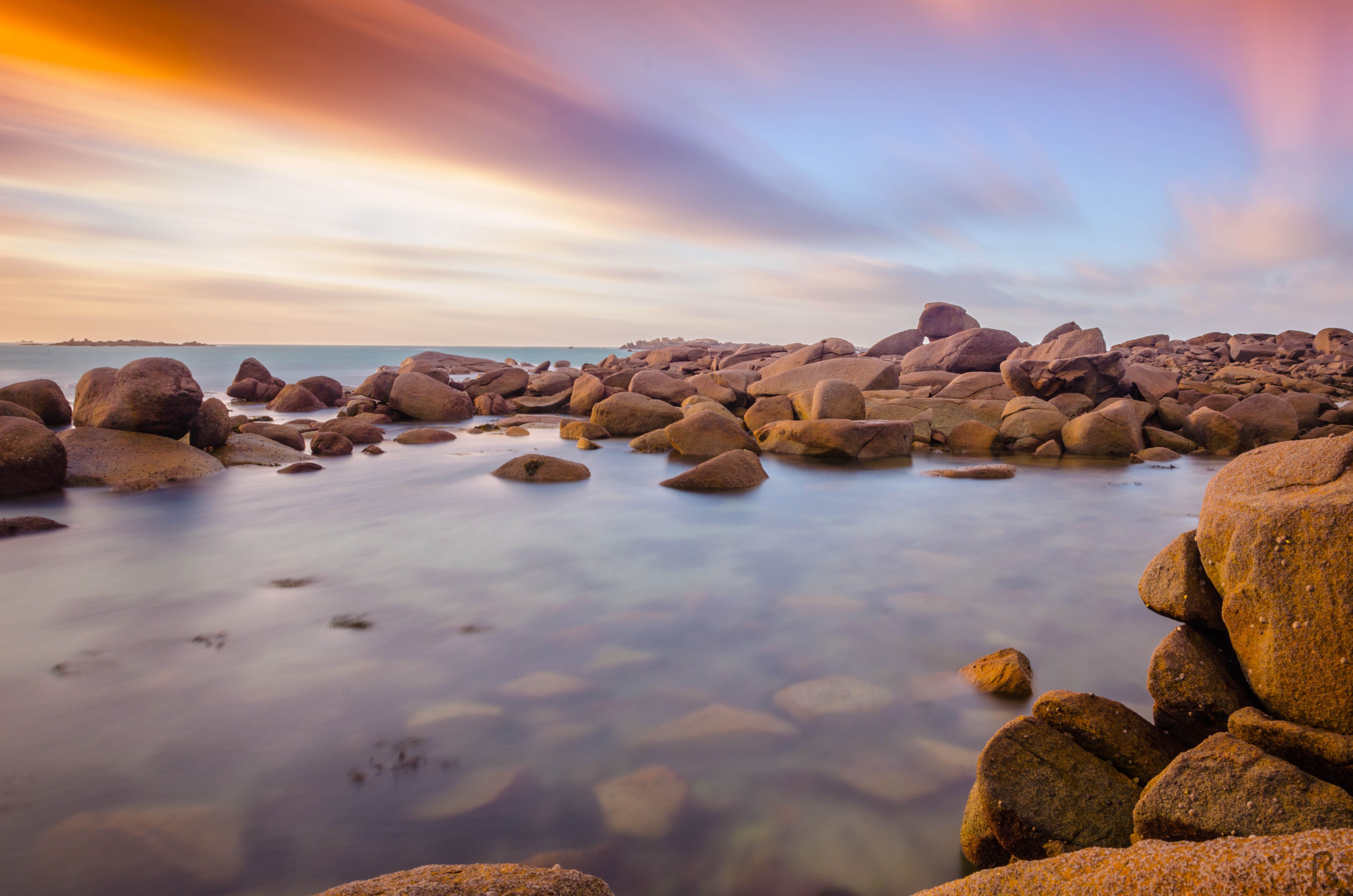 Beautiful Brown Rocks on the Sea Under Beautiful Sky · Free Stock Photo