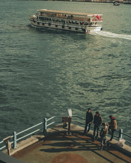 Free People Standing on a Concrete Dock Stock Photo