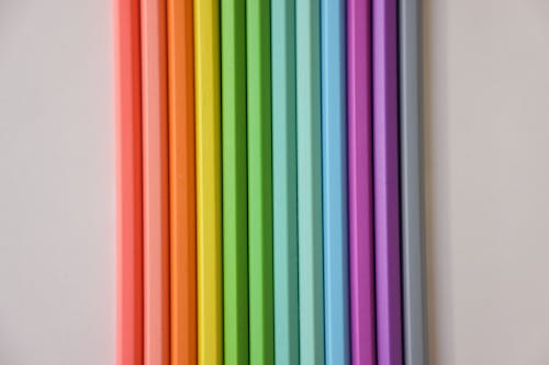 Colorful Sticks on a White Surface