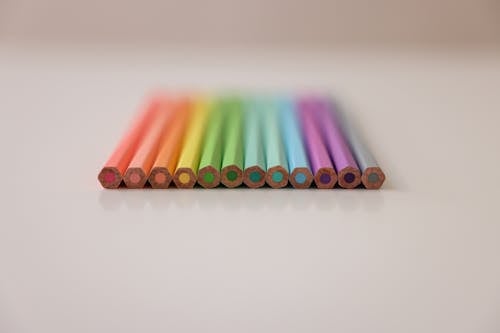 Free Unsharpened Colored Pencils on a White Surface Stock Photo