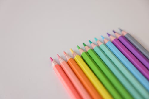 Free Multi Colored Coloring Pencils on White Surface Stock Photo