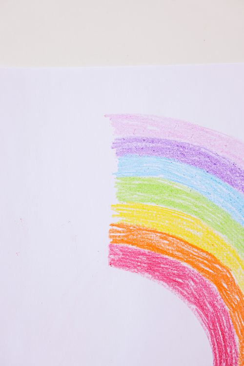 Free A vibrant rainbow drawing in crayons on white bond paper, perfect for art projects. Stock Photo