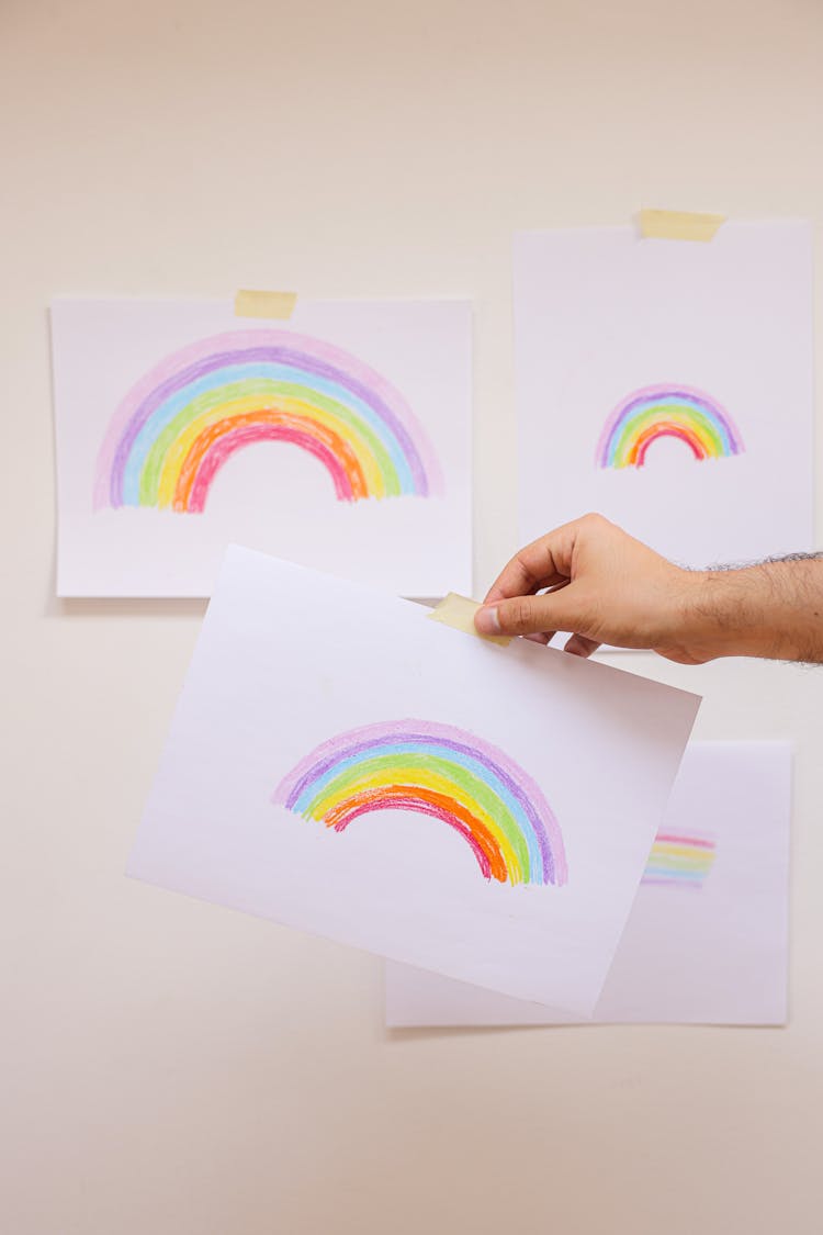 Rainbow Drawings On Bond Paper Posted On A Wall