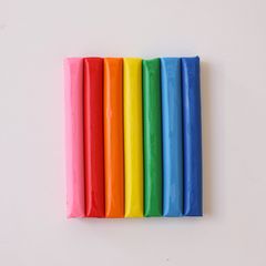 Bars of brightly coloured modelling clay in a row