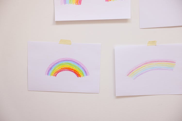 Rainbow Drawing On White Papers Stick On The Wall