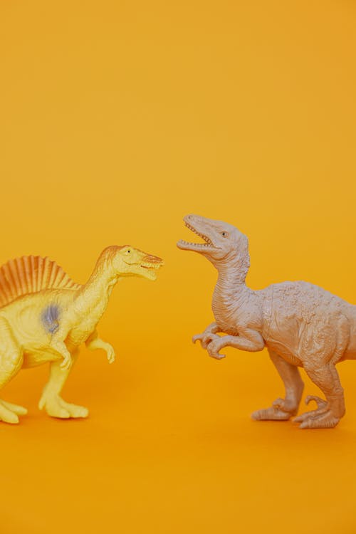 Dinosaur Plastic Toys on Yellow Surface