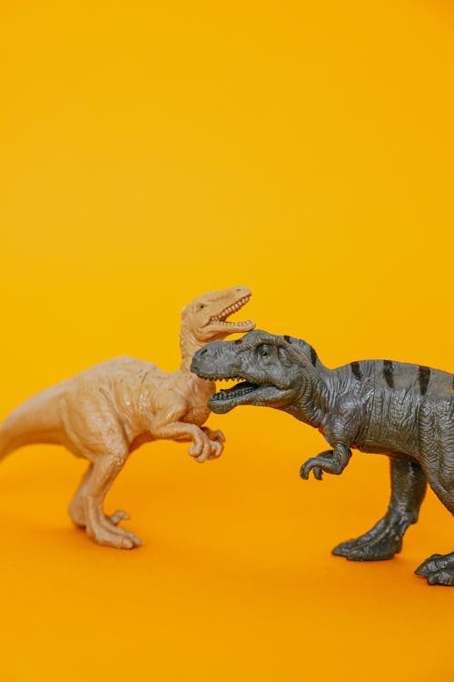 Dinosaur Toys  on a Yellow Surface