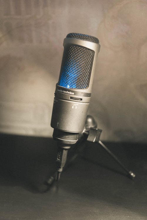 Gray Microphone on White Textile