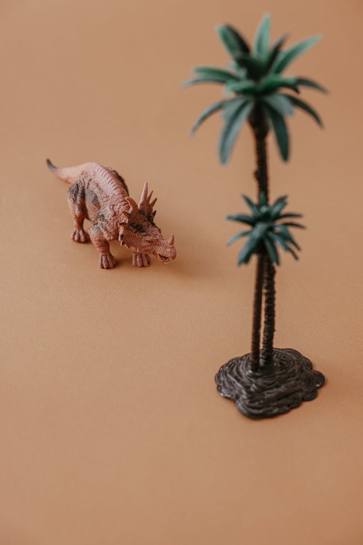 Plastic Dragon And Miniature And Tree