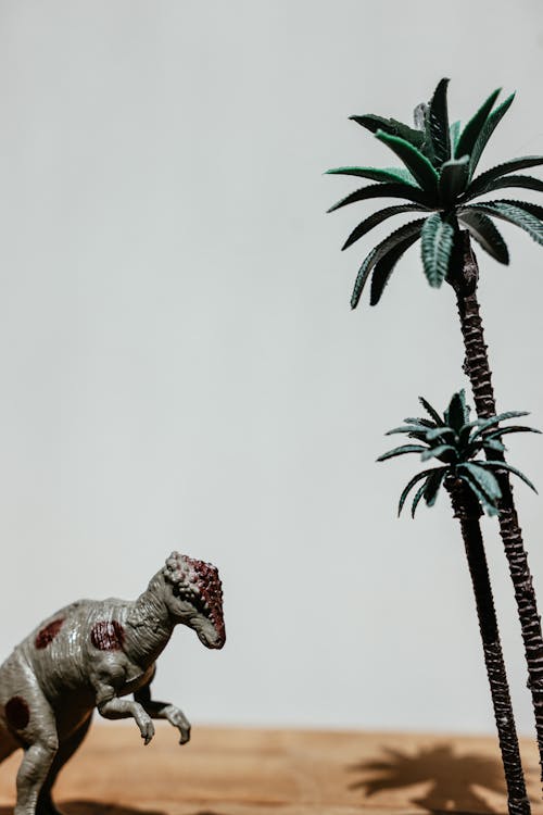 Plastic Dinosaur and Palm Trees Figurines