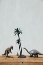 Mini Dinosaurs Near Miniature Palm Tree
