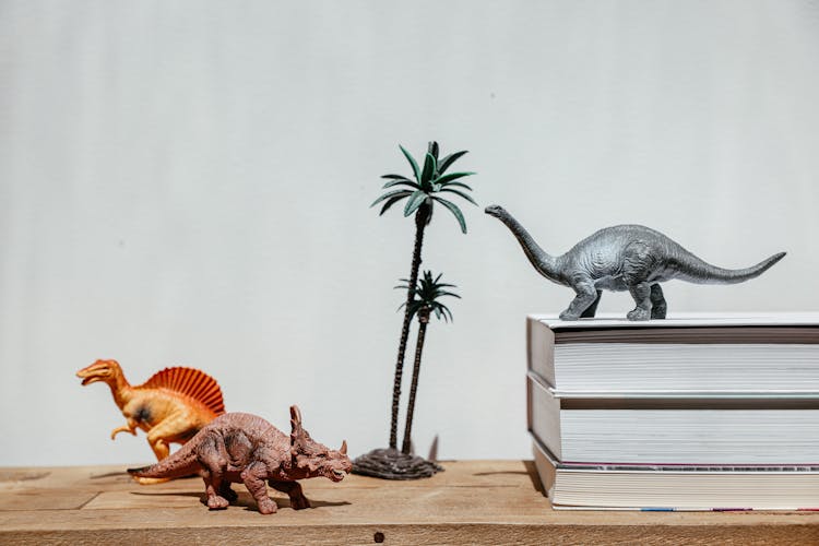 Still Life With Plastic Dinosaurs And Books