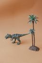 Gray Dragon Figurine on Brown Wooden Table