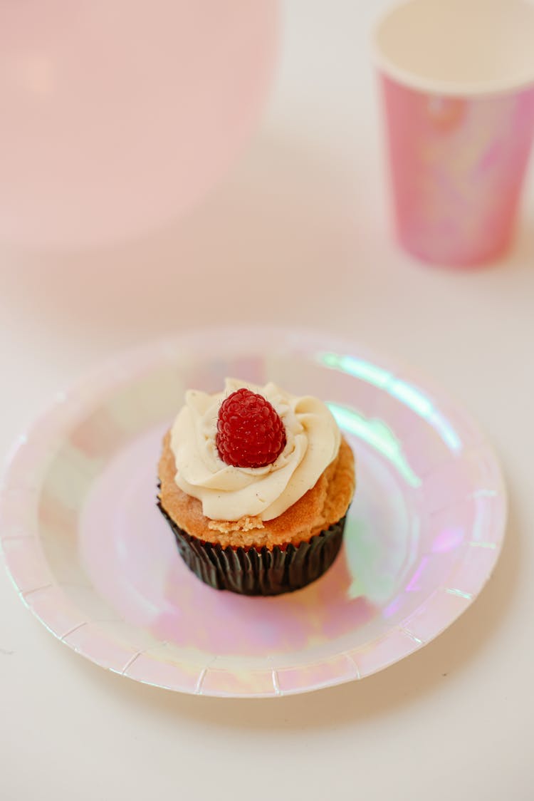 Cupcake With Raspberry Topping