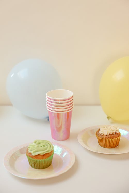 Free A Cupcakes on the Table Near the Disposable Cups and Balloons Stock Photo