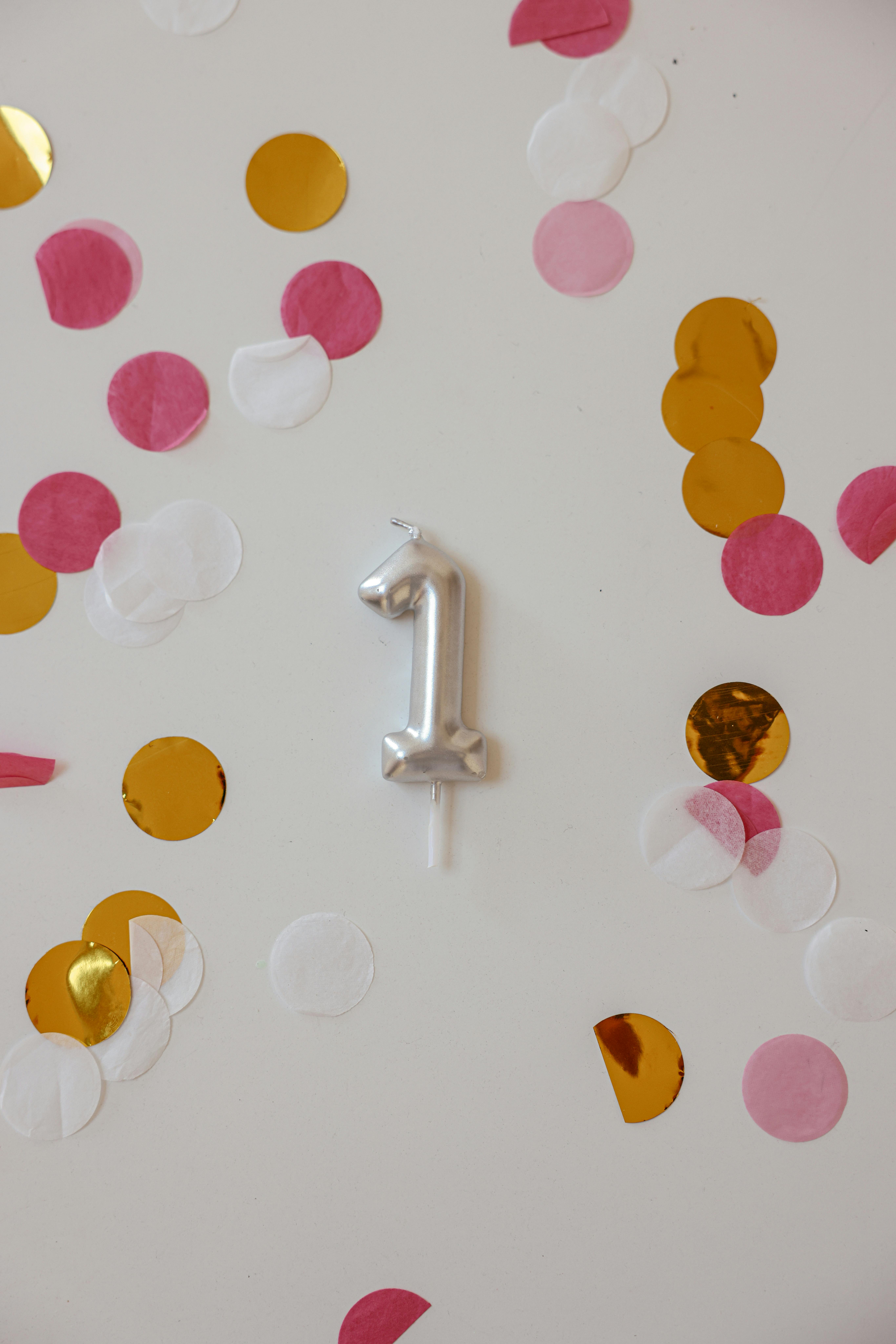 a silver number balloon hanging in the wall