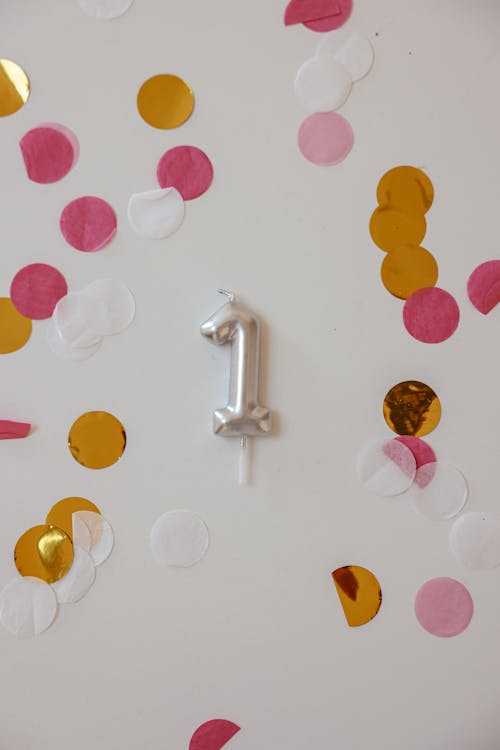 Free A Silver Number Balloon Hanging in the Wall Stock Photo