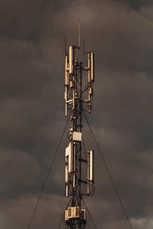 Close-up of a Radio Mast Against a Dark Stormy Sky 