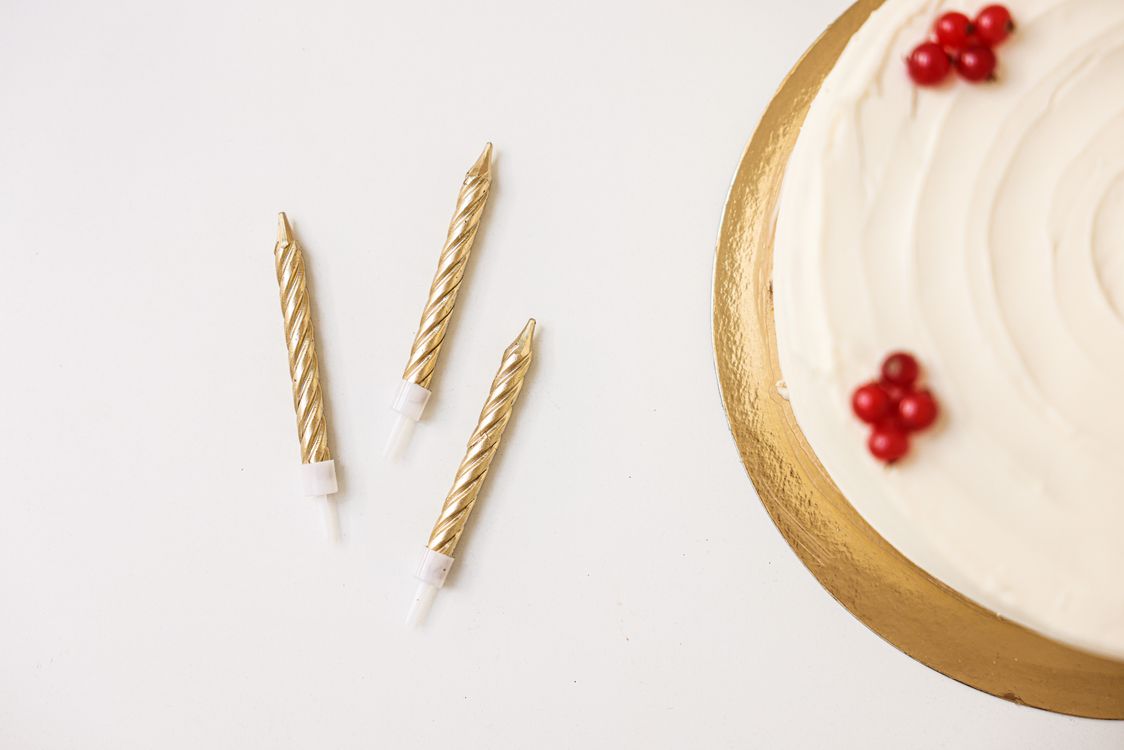 Golden spiral candles on a table for a celebration