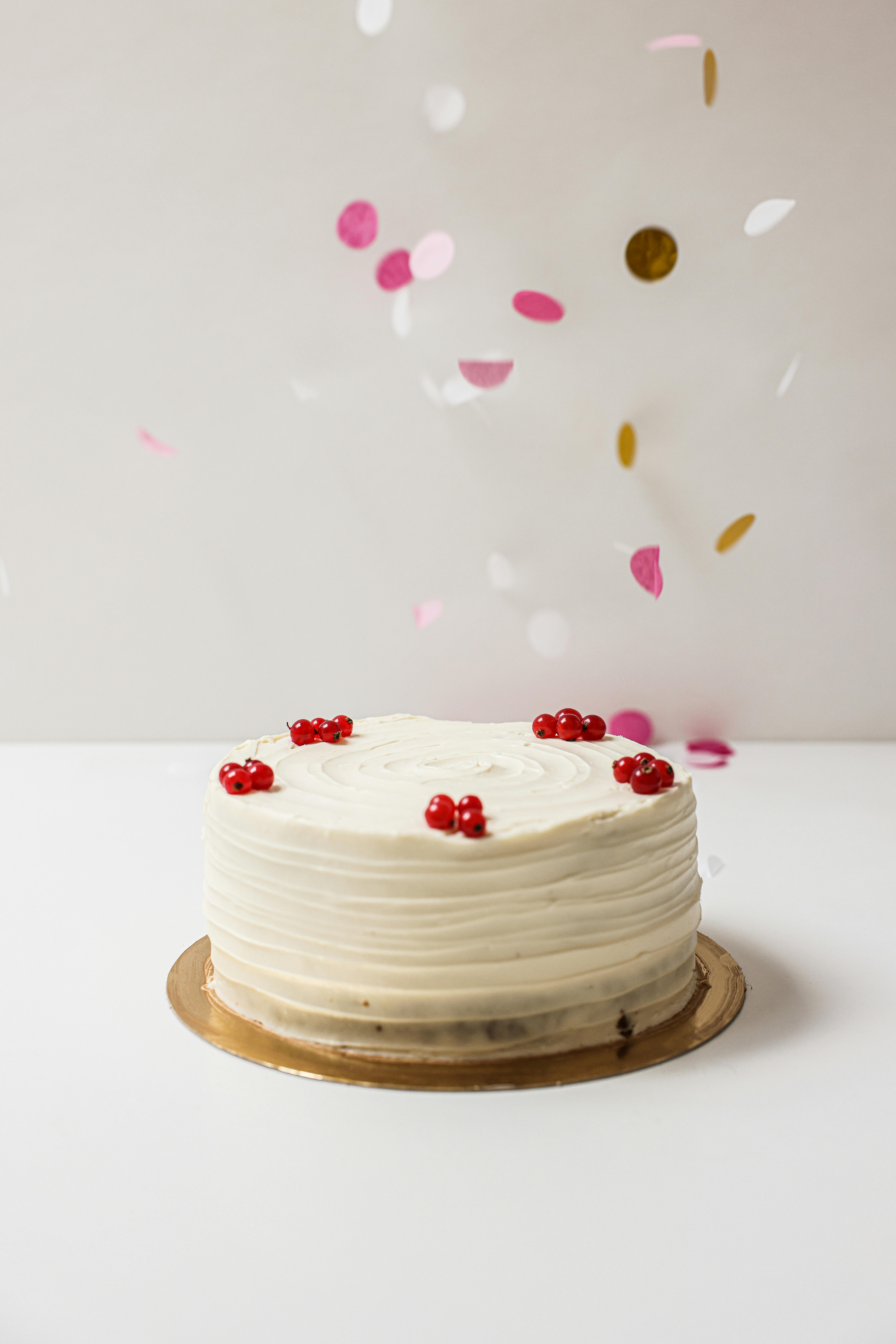 White frosted cake with confetti