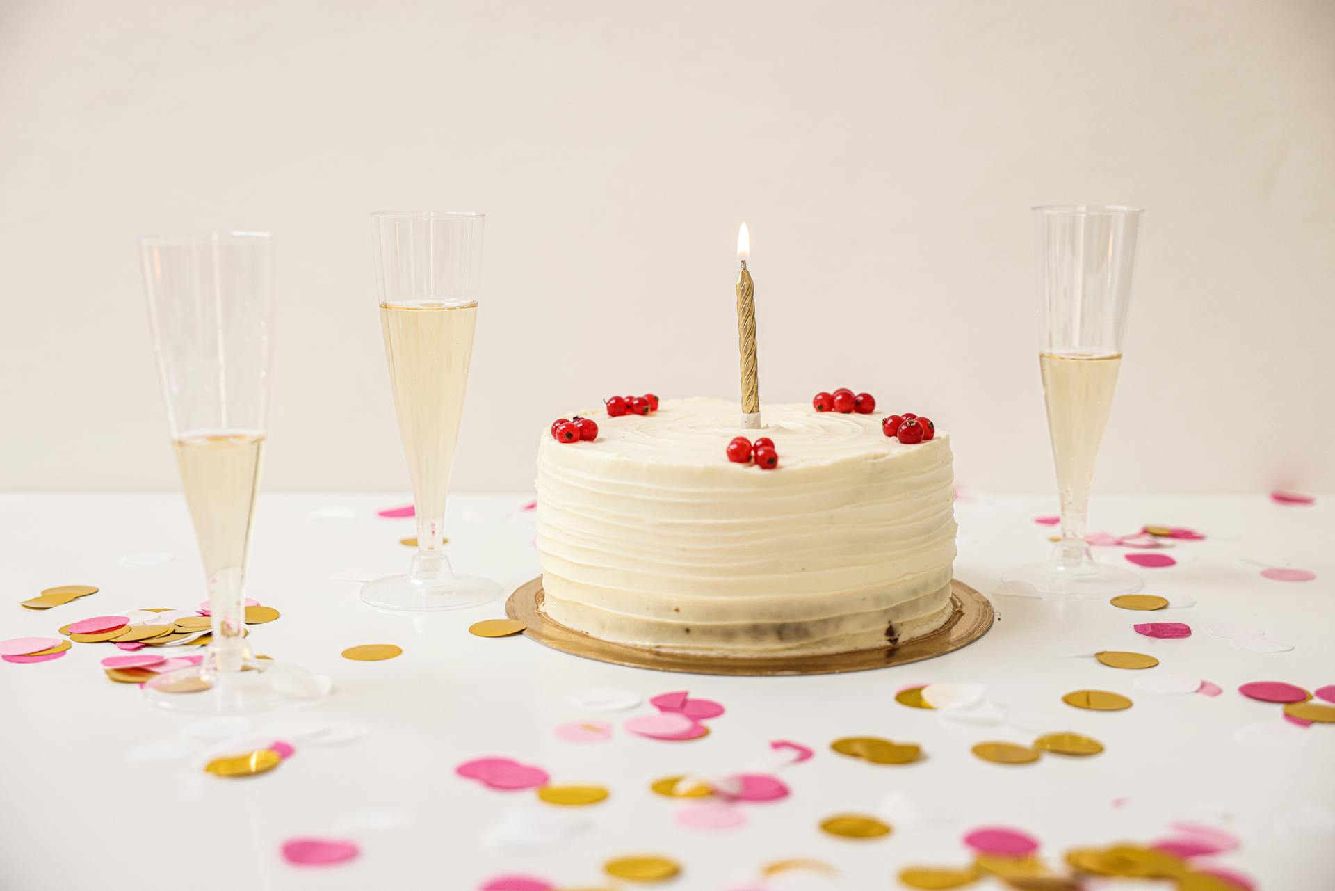 Lighted Candle on a Birthday Cake