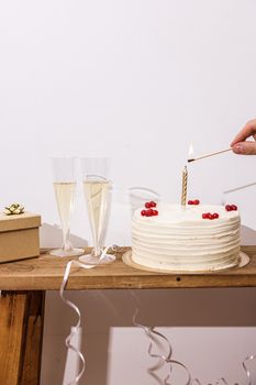 A festive scene with a cake, champagne glasses, and a gift box, perfect for celebrations.