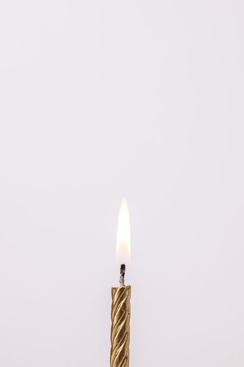 Free Lighted Gold Candle  Stock Photo