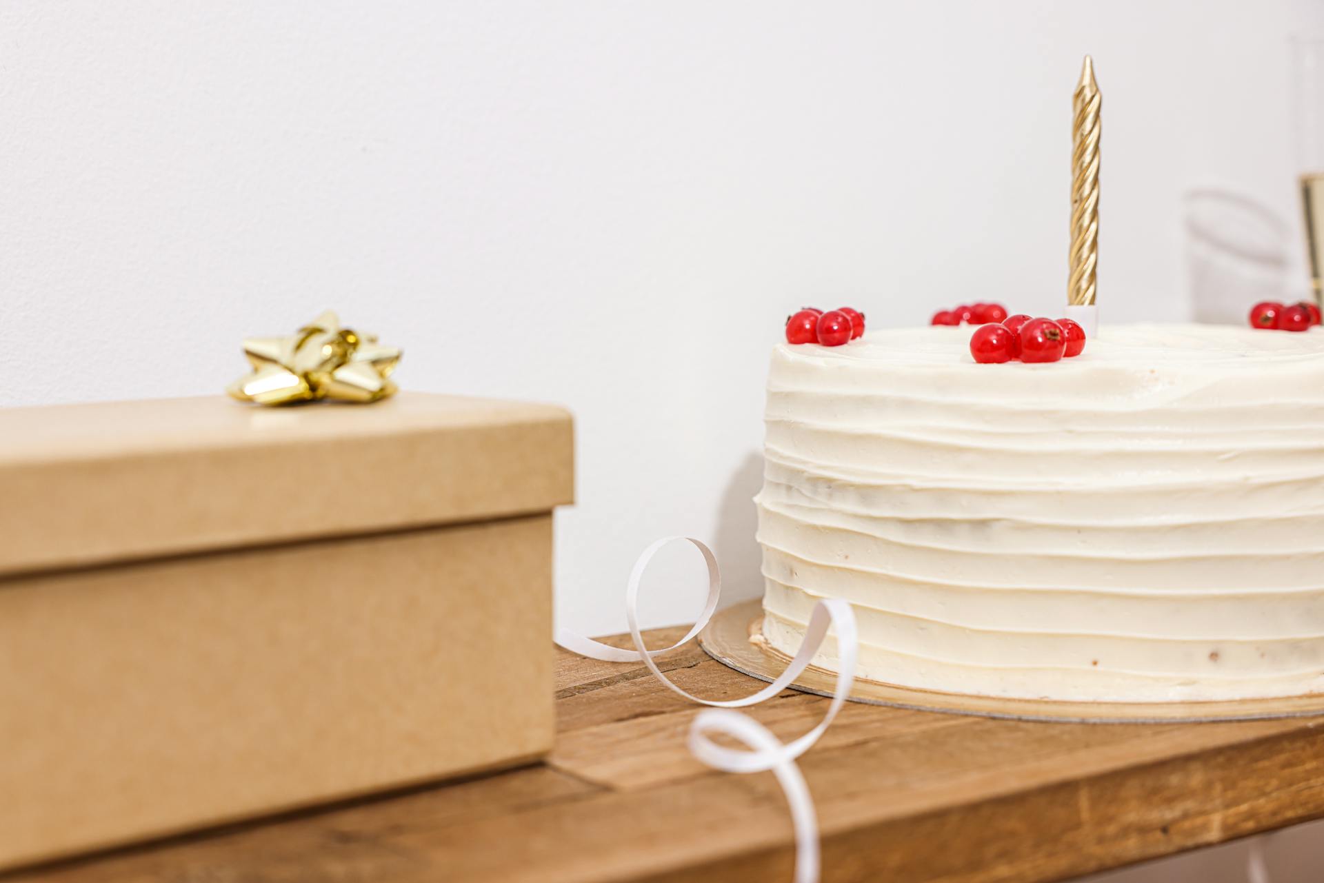 A Close-Up Shot of a Cake and a Gift Box