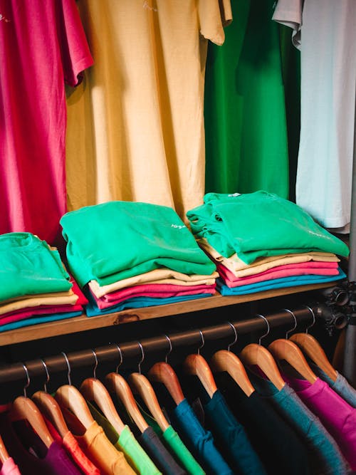 Close-up of Colorful Clothes Neatly Organized in the Closet 