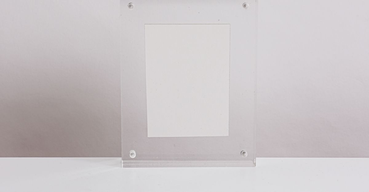 A Translucent Empty Frame on a White Surface · Free Stock Photo