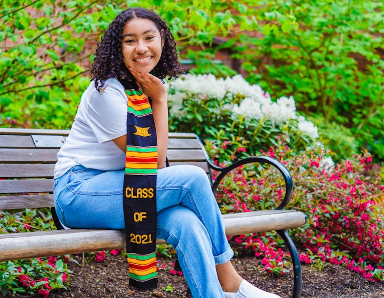 A Woman Wearing A Graduation Stole 