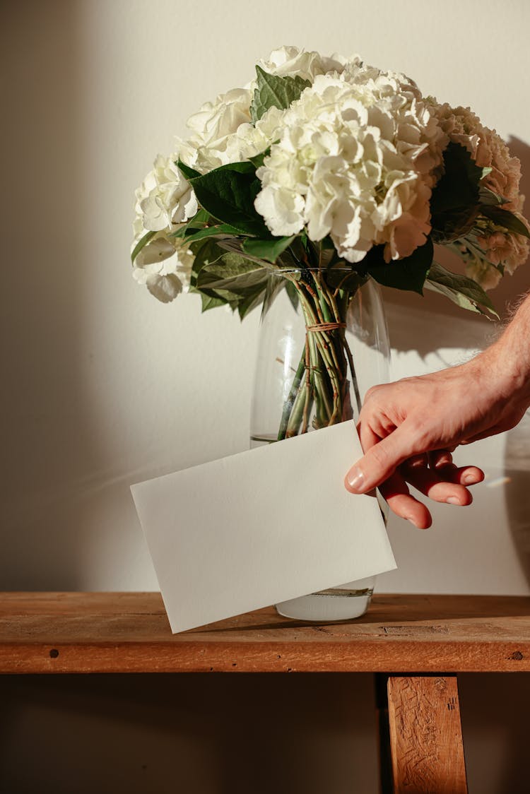 A Person Holding A Card 