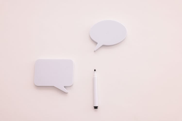 Blank Speak Up Board Beside A Pen