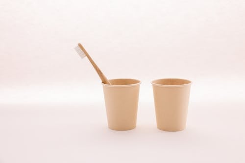 A Toothbrush in a Disposable Paper Cup