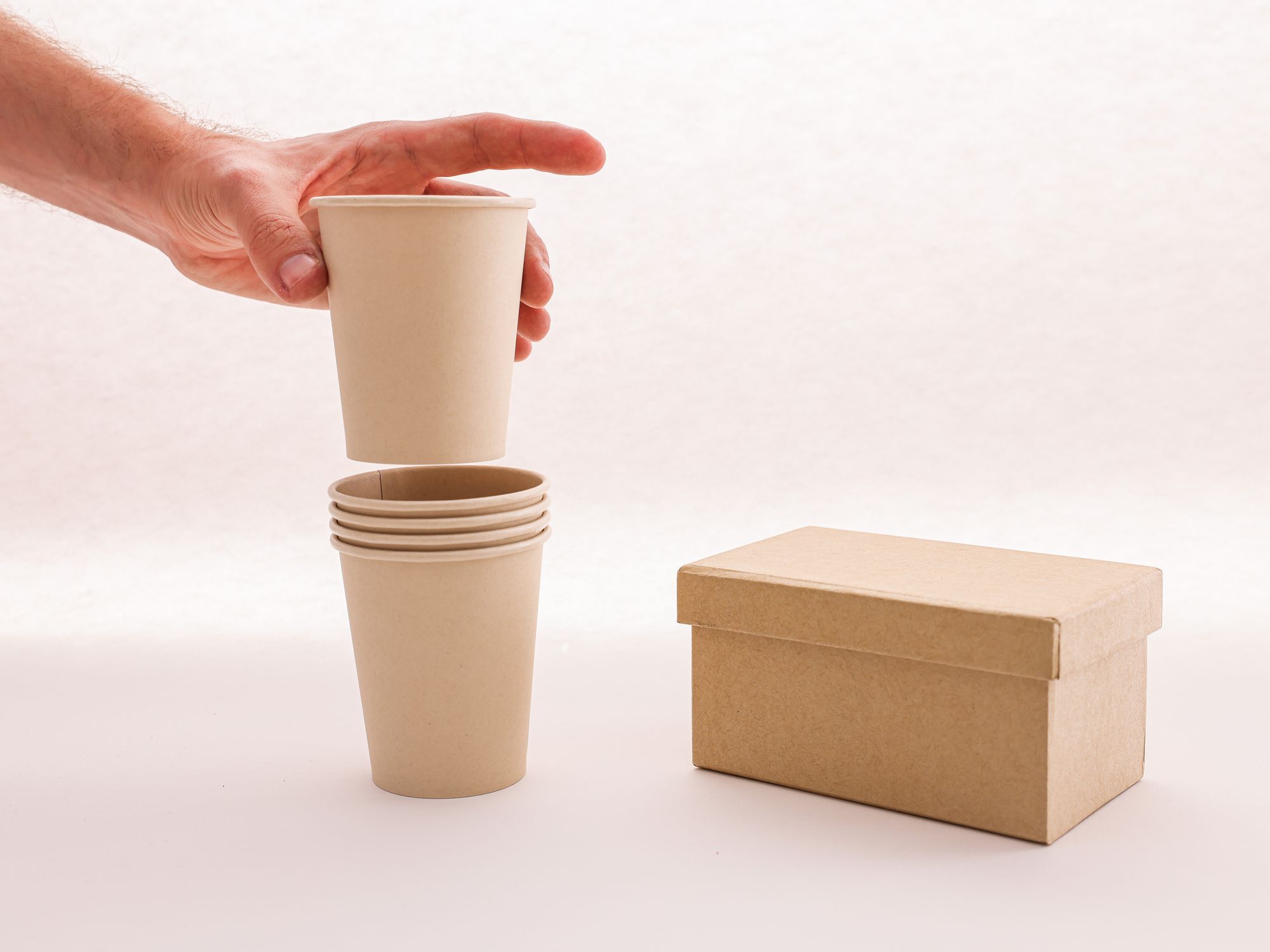 Packing Services in Carron, Scotland — professional packer wrapping fragile items in a box