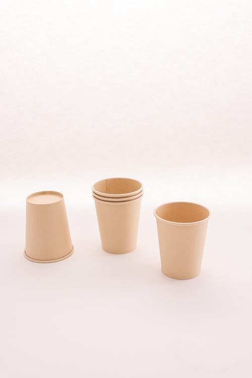 Paper Cups on White Surface