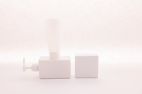 Free White Dispenser Pump and White Tube Stock Photo