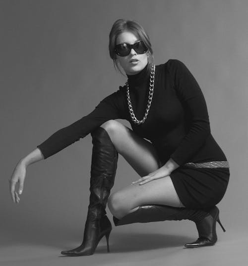 Grayscale Photo of a Stylish Woman