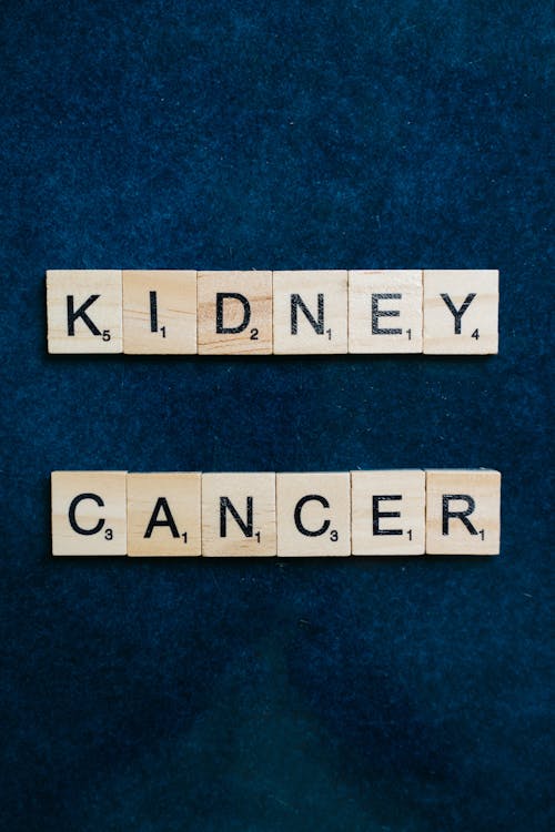 Kidney Cancer Spelled with Scrabble Tiles on a Blue Surface