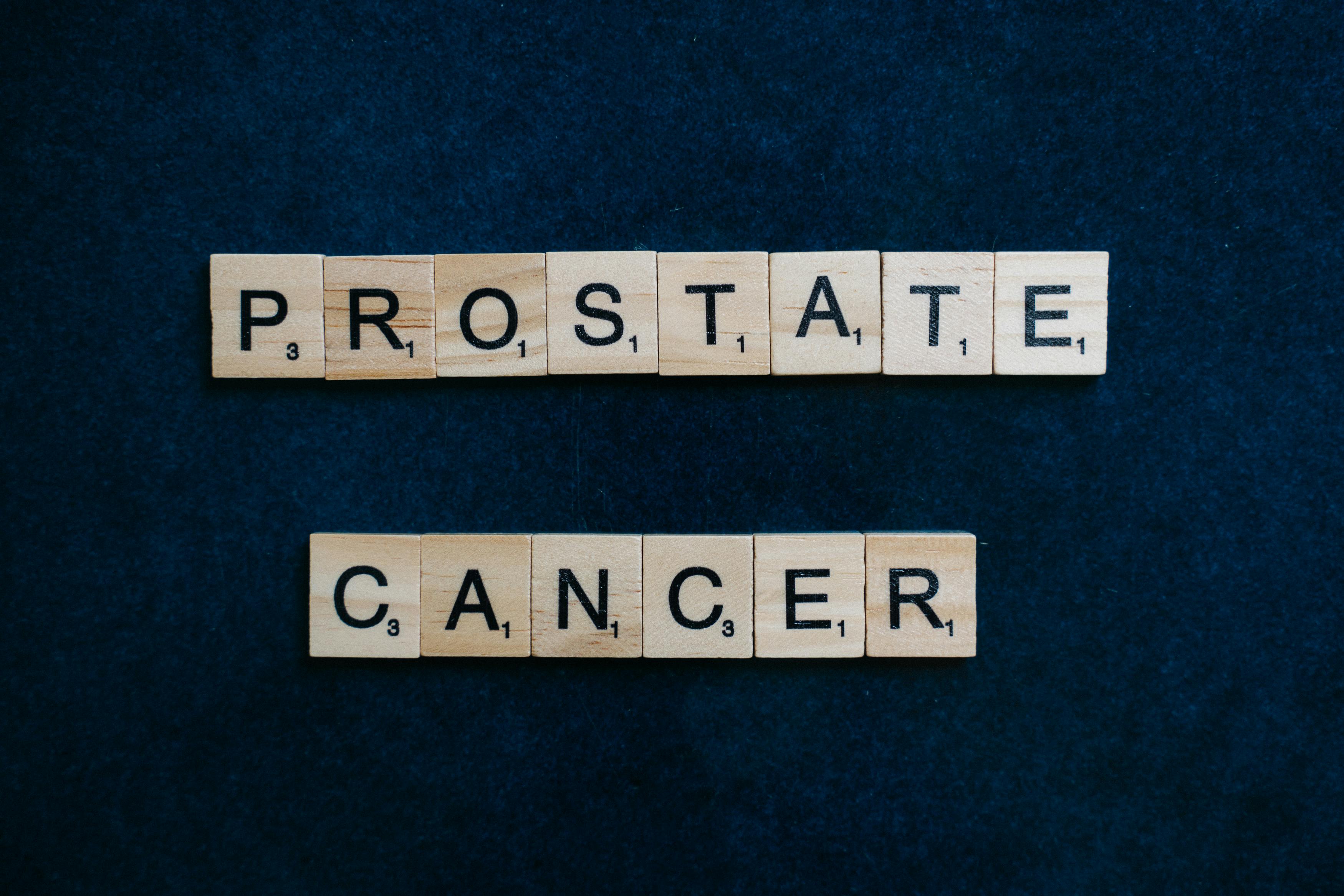 Text 'Prostate Cancer' on tiles against a dark blue backdrop promoting awareness.