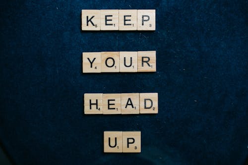 Keep Your Head Up Spelled on Scrabble Tiles