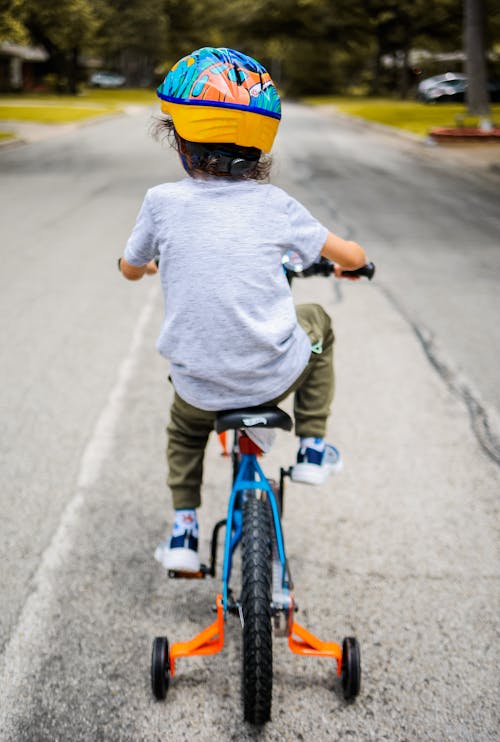 Free A Kid Riding a Bike  Stock Photo