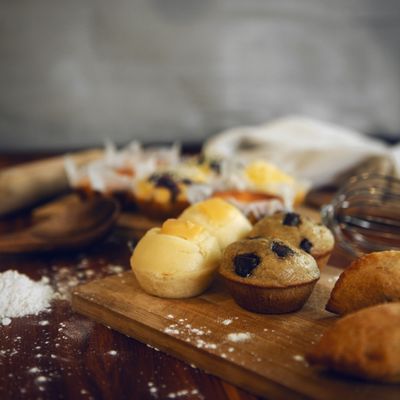 Mini muffins on a wooden board — photo by Dee Dave on Pexels