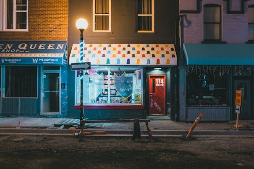 Illuminating Lamp Post near Stores 