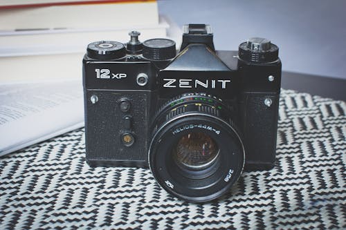 Black Zenit Dslr Camera on Top of Table